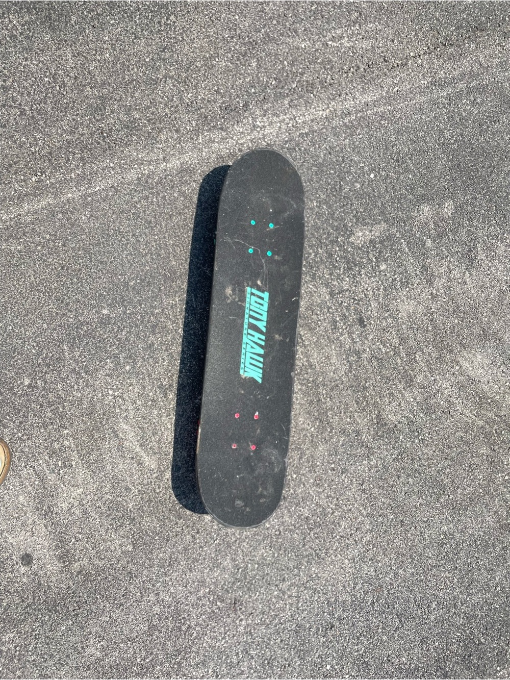 Tony Hawk Black Skateboard Deck with Teal Logo and Red Accents